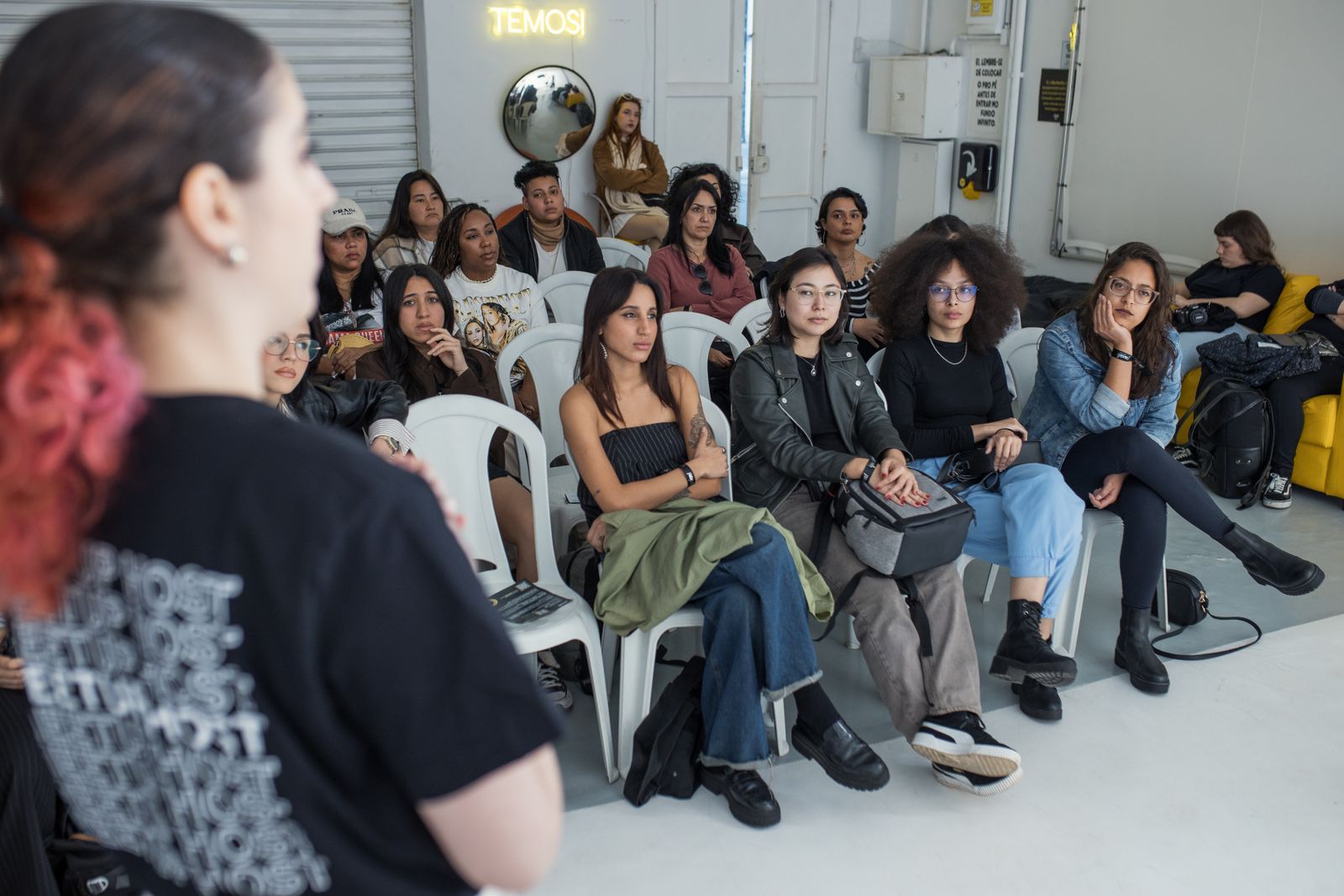 Attendees listening at a community benefits workshop